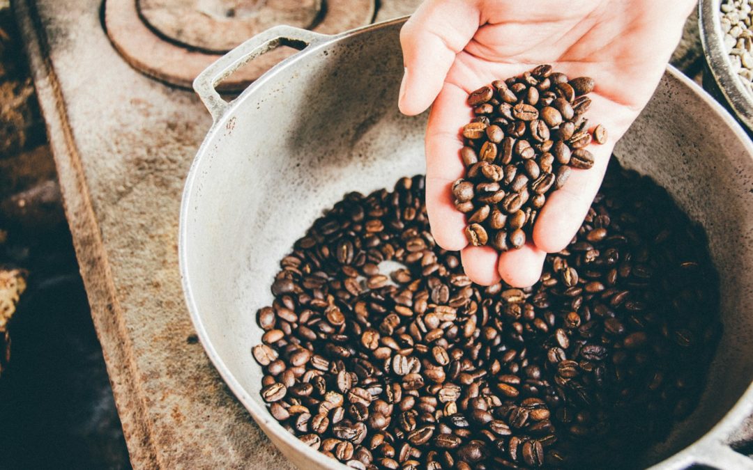 coffee beans on gray steel wok